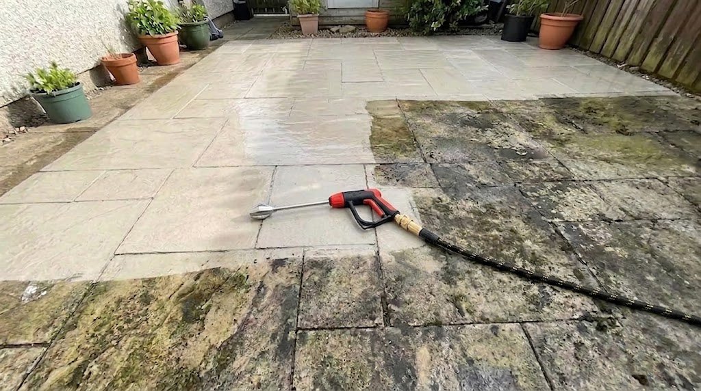 Outdoor patio showing a cleaner section alongside a section with visible grime